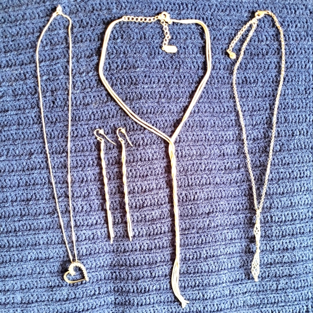 Bundle of silver necklaces and pair of earrings